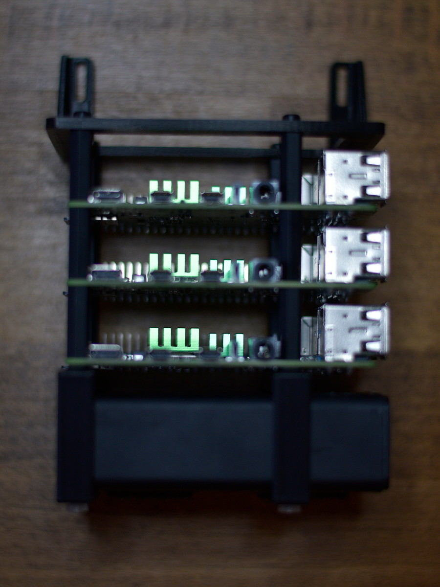 Hardware parts for Pi 2 and Pi 3 laid out on table