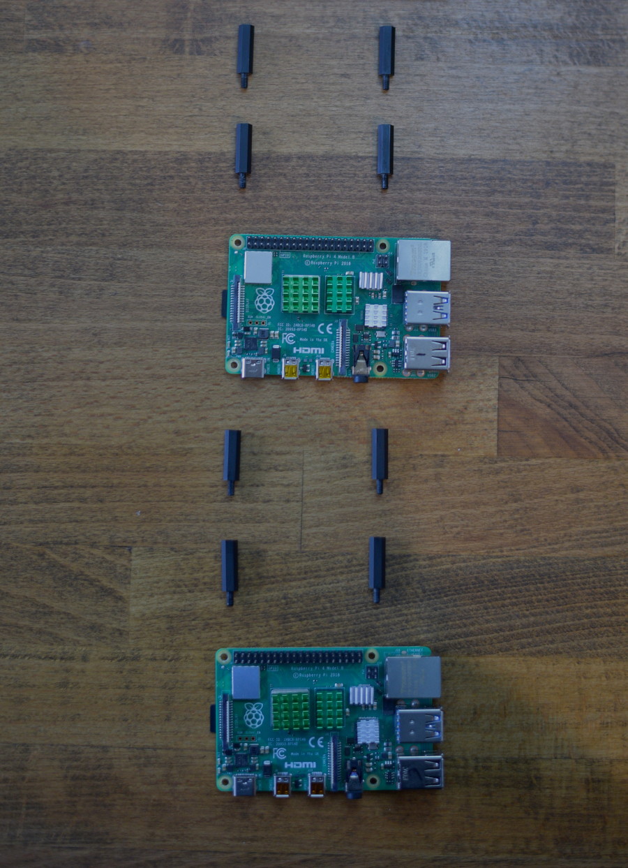 Hardware parts for Pi 2 and Pi 3 laid out on table